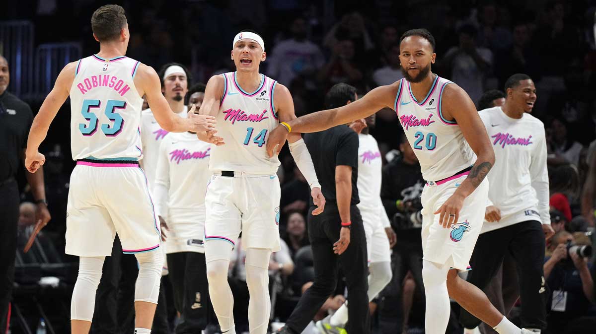 Miami Heat forward Duncan Robinson (55) guard Tyler Herro (14) and forward Kyle Anderson (20) celebrate their team scoring 8 points in 22 seconds against the Minnesota Timberwolves during the second half at Kaseya Center.