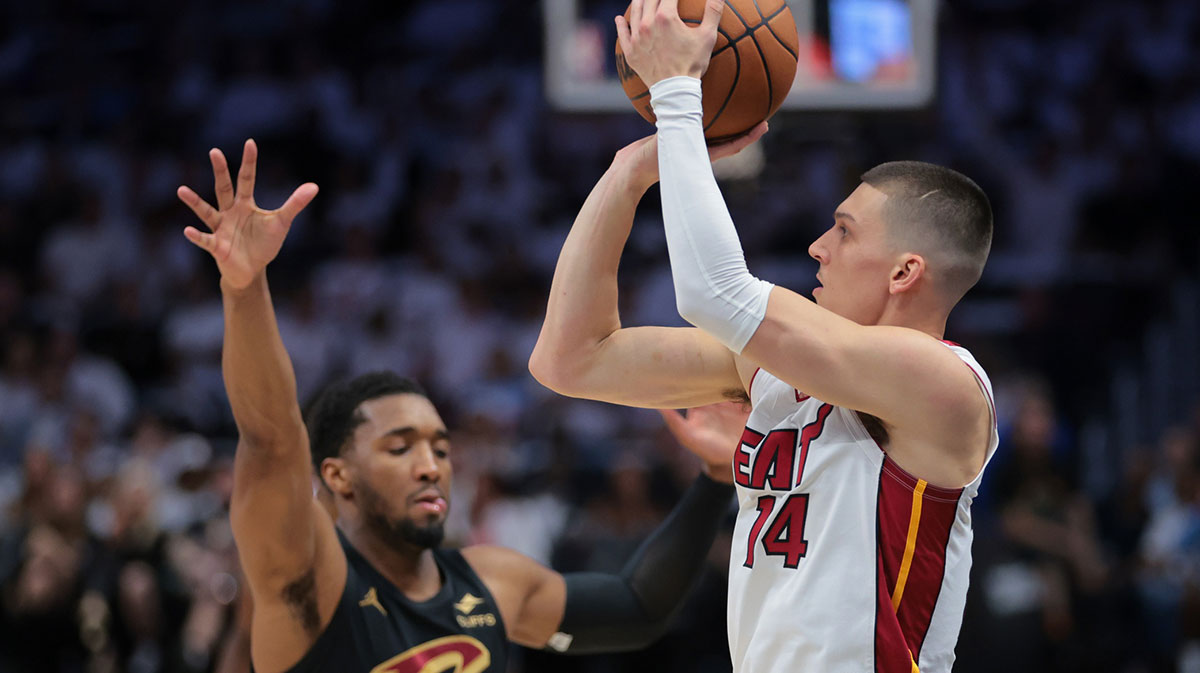 Miami Heat guard Tyler Herro (14) shoots the basketball over Cleveland Cavaliers guard Donovan Mitchell (45) in the first quarter during game four for the first round of the 2025 NBA Playoffs at Kaseya Center.