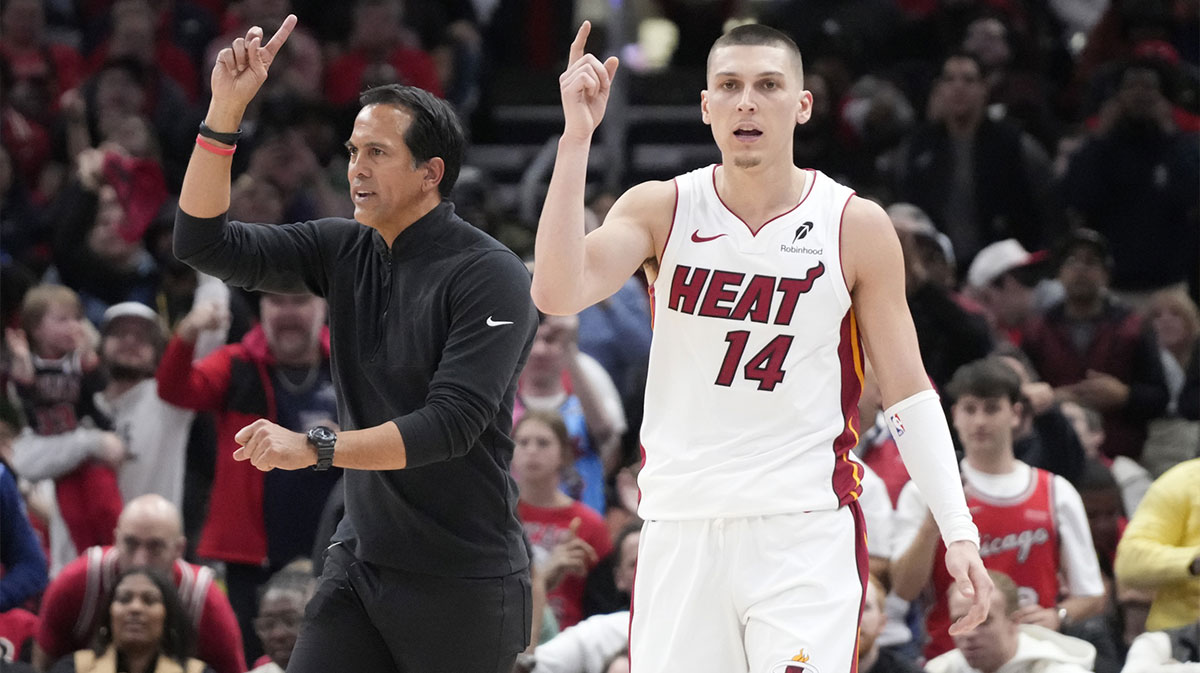 Miami Heat guard Tyler Herro (14) and head coach Erik Spoelstra ask for a replay against the Chicago Bulls during the second half at United Center.