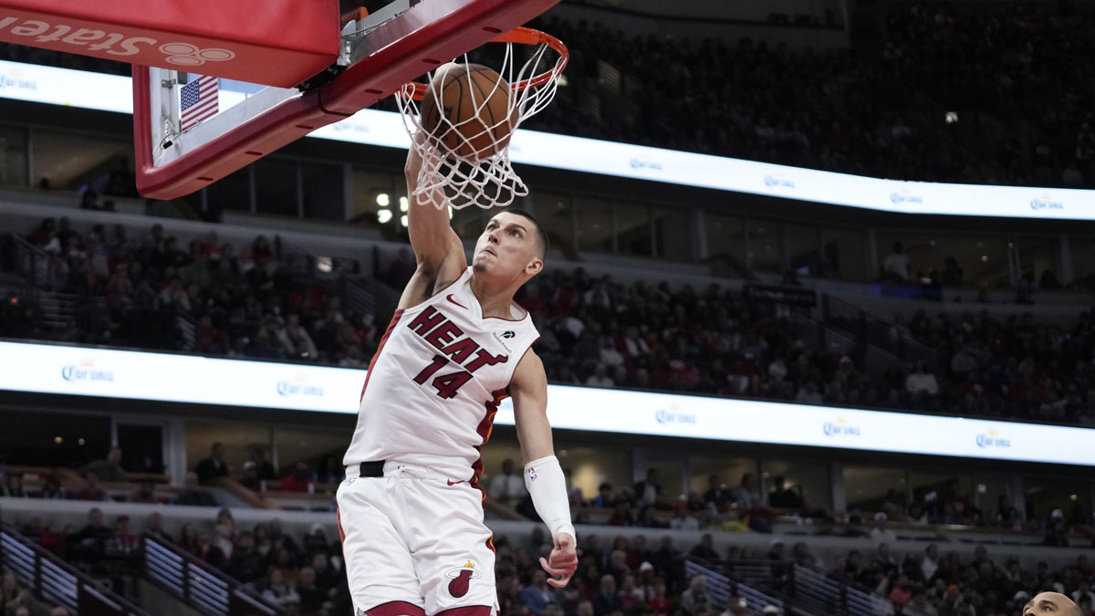 Miami Heat guard Tyler Herro (14) dunks on Chicago Bulls forward Talen Horton-Tucker (22) during the second half at United Center.