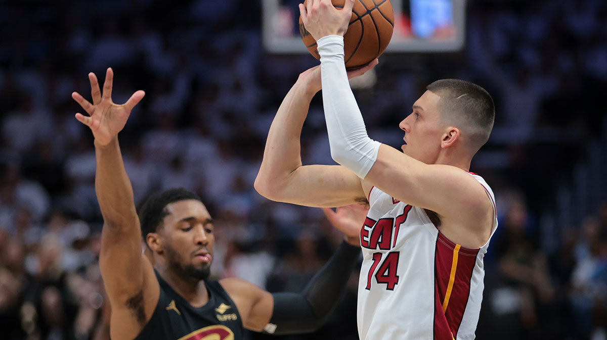 Miami Heat guard Tyler Herro (14) shoots the basketball over Cleveland Cavaliers guard Donovan Mitchell (45) in the first quarter during game four for the first round of the 2025 NBA Playoffs at Kaseya Center.