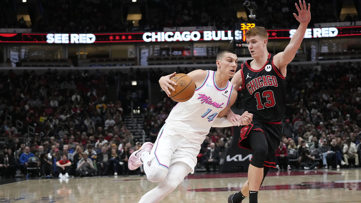 Chicago Bulls guard Kevin Huerter (13) defends Miami Heat guard Tyler Herro (14) during the second half at United Center.