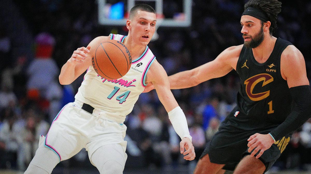 Miami Heat guard Tyler Herro (14) drives to the basket as Cleveland Cavaliers guard Max Strus (1) defends during the second half at Kaseya Center.