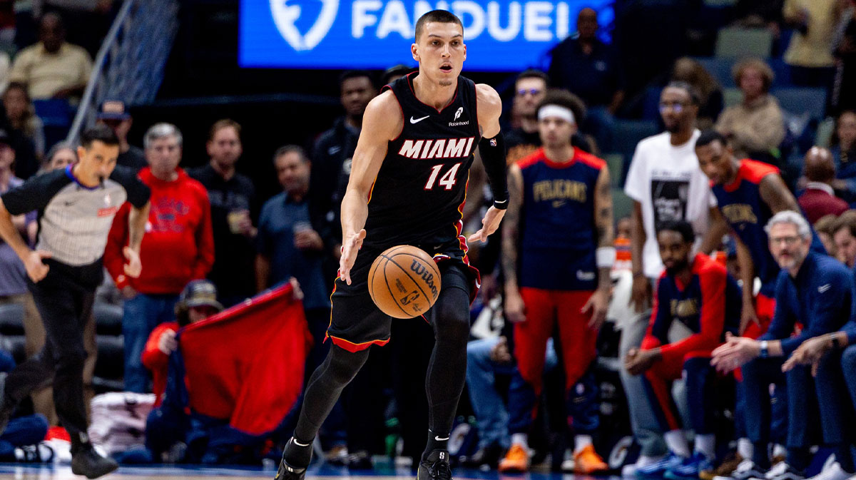 Miami Heat guard Tyler Herro (14) brings the ball up court against the New Orleans Pelicans during the first half at Smoothie King Center.