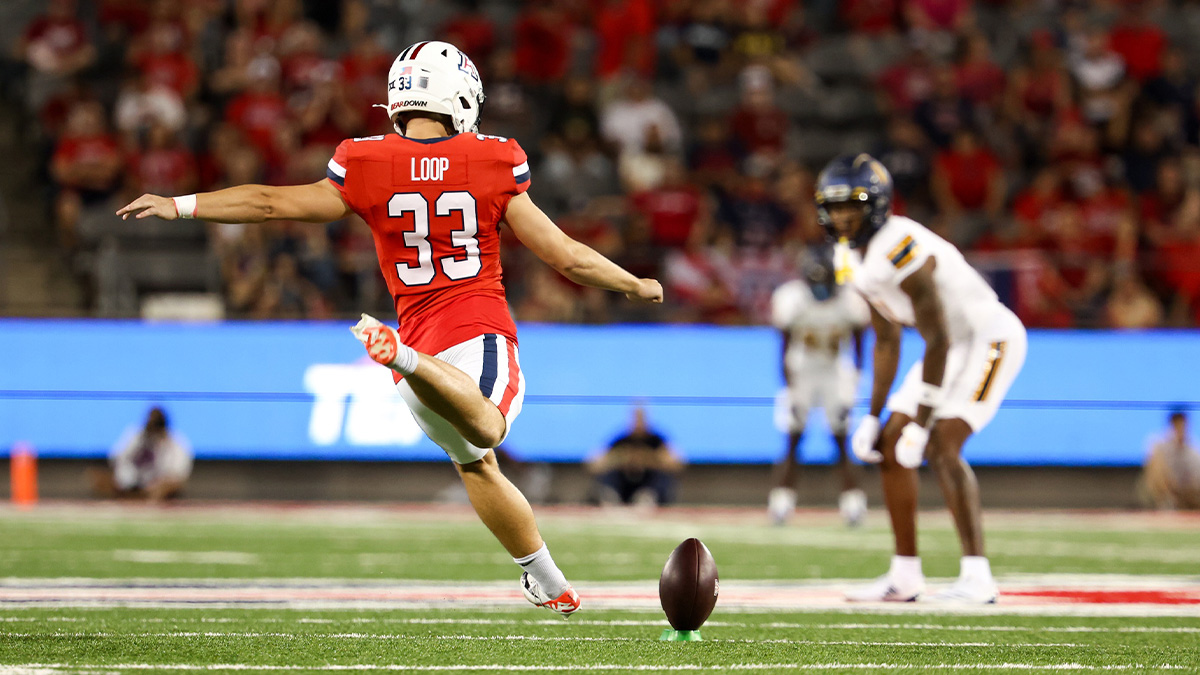 Arizona Wildcats Tyler Loop (33) goes to kick the bal during kickoff against Northern Arizona Lumberjacks during first quarter at Arizona Stadium.