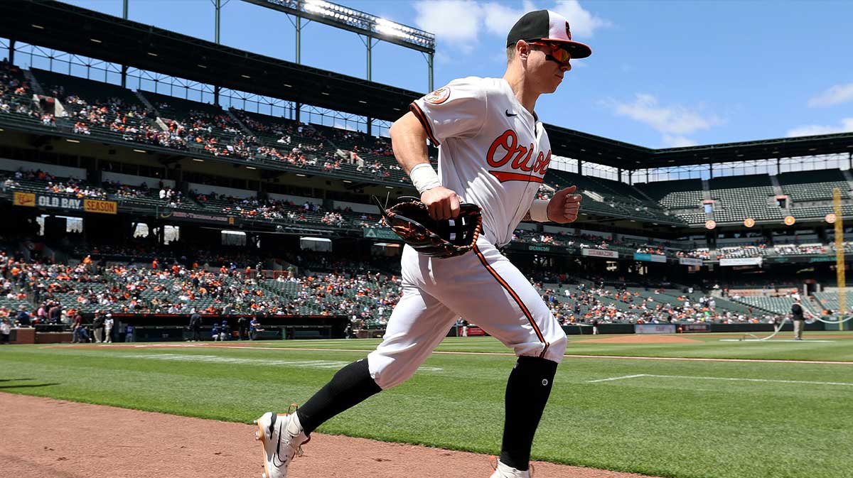 Apr 13, 2025; Baltimore, Maryland, USA; Baltimore Orioles outfielder Tyler O'Neill (9) runs on to the field before a game against the Toronto Blue Jays at Oriole Park at Camden Yards. Mandatory Credit: Daniel Kucin Jr.-Imagn Images