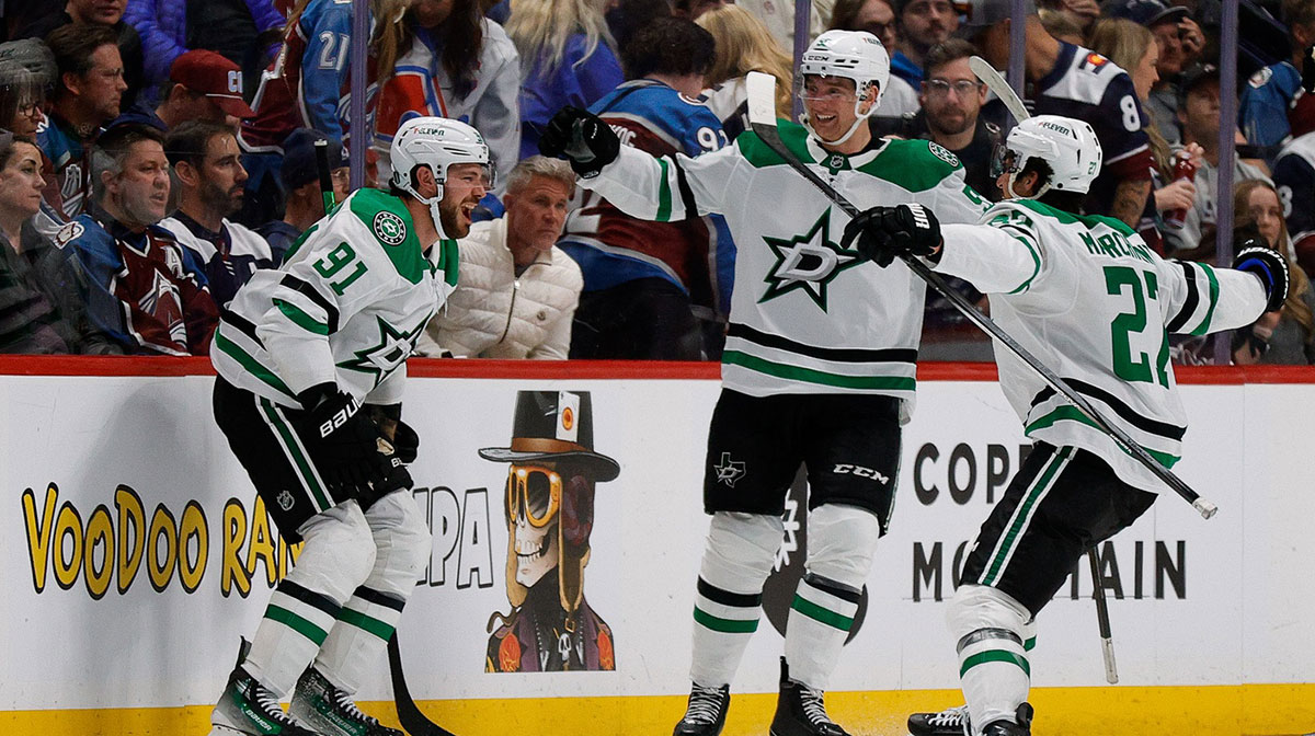 Dallas Stars center Tyler Seguin (91) celebrates his game winning goal with defenseman Thomas Harley (55) and left wing Mason Marchment (27) in overtime against the Colorado Avalanche in game three of the first round of the 2025 Stanley Cup Playoffs at Ball Arena.