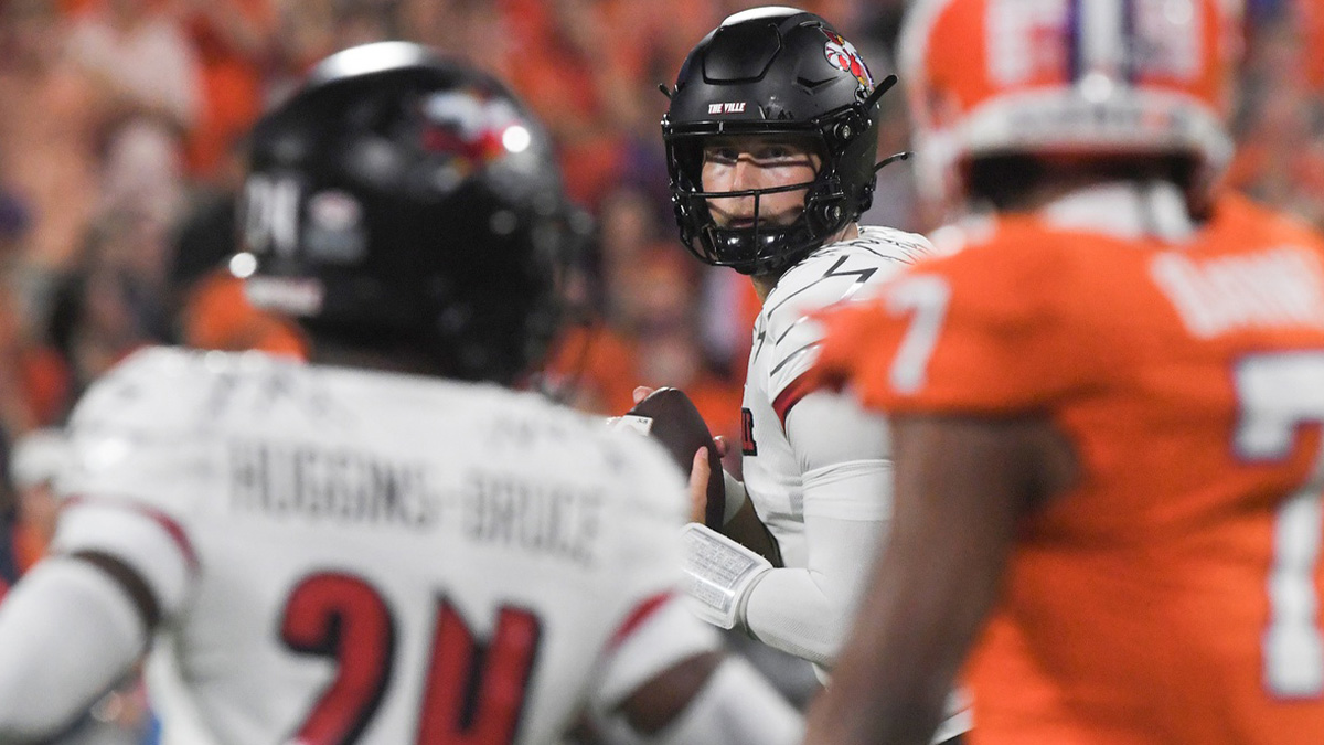 Louisville Cardinals quarterback Tyler Shough (9) throws a pass against Clemson Tigers safety Khalil Barnes (7) during the first quarter at Memorial Stadium.