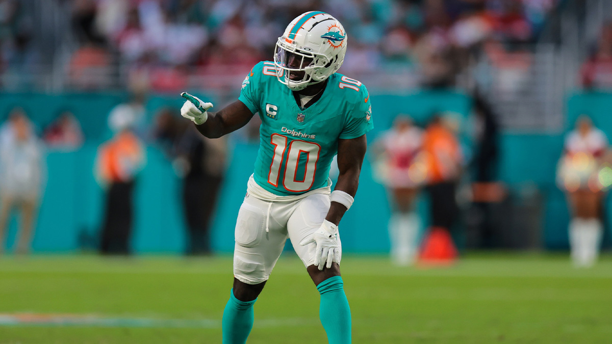 Miami Dolphins wide receiver Tyreek Hill (10) signals from the line of scrimmage against the San Francisco 49ers during the second quarter at Hard Rock Stadium.