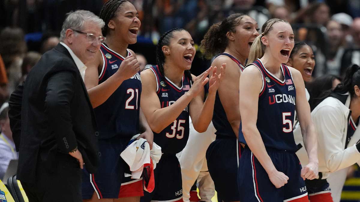 Connecticut (UConn) Huskies guard Paige Bueckers (5) reacts with teammates on the bench during the fourth quarter in a semifinal of the women's 2025 NCAA tournament against the UCLA Bruins at Amalie Arena.