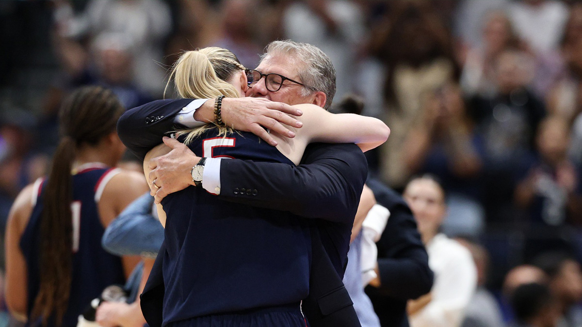 Connecticut Huskies head coach Geno Auriemma hugs guard Paige Bueckers (5) during the second half against the South Carolina Gamecocks of the national championship of the women's 2025 NCAA tournament at Amalie Arena.