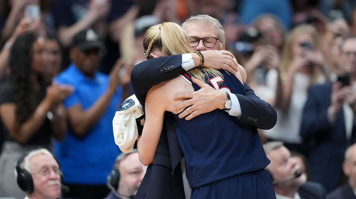 Connecticut Huskies head coach Geno Auriemma hugs guard Paige Bueckers (5) during the second half against the South Carolina Gamecocks of the national championship of the women's 2025 NCAA tournament.