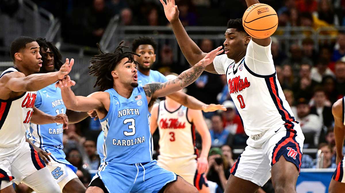 North Carolina Tar Heels guard Elliot Cadeau (3) and Mississippi Rebels forward Malik Dia (0) chase a loose ball during the second half of a first round NCAA men’s tournament game at Fiserv Forum. Mandatory Credit: Benny Sieu-Imagn Images
