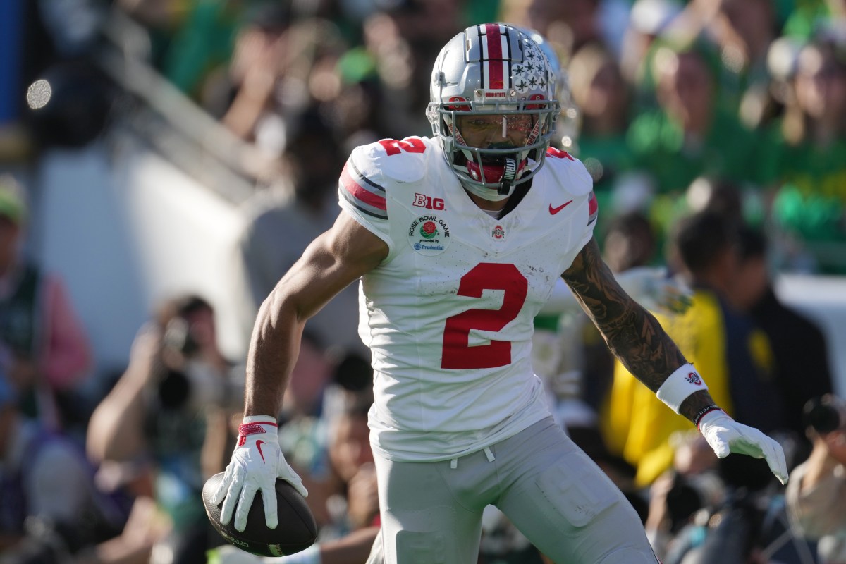 Ohio State Buckeyes wide receiver Emeka Egbuka (2) celebrates after scoring a touchdown against the Oregon Ducks in the first quarter during the 2025 Rose Bowl college football quarterfinal game at Rose Bowl Stadium.