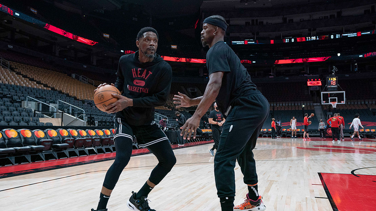 Miami Heat forward Udonis Haslem (40) controls the ball as forward Jimmy Butler (22) tries to defend during the warms up against the Toronto Raptors at Scotiabank Arena.