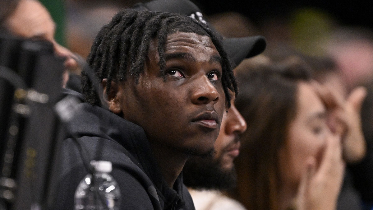Miami Hurricanes Quarterback Cam Ward watches the game between the Dallas Mavericks and the Golden State Warriors during the second half at the American Airlines Center.