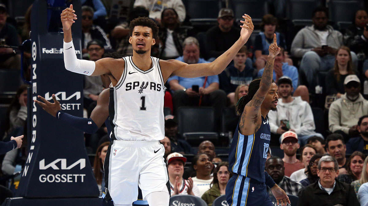 San Antonio Spurs center Victor Wembanyama (1) and Memphis Grizzlies guard Ja Morant (12) react during the first quarter at FedExForum.