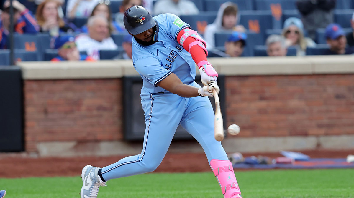 Toronto Blue Jays first baseman Vladimir Guerrero Jr. (27) hits a single during the eighth inning against the New York Mets at Citi Field.