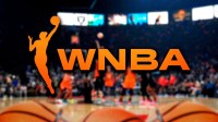 the wnba draft logo with a basketball court in the background and three basketballs near the bottom