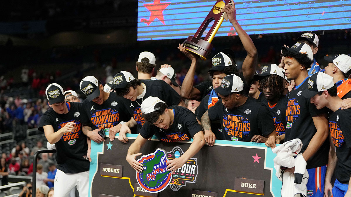 Florida Gators guard Walter Clayton Jr. (1) places their team on the bracket after winning the national championship game of the Final Four of the 2025 NCAA Tournament at the Alamodome.