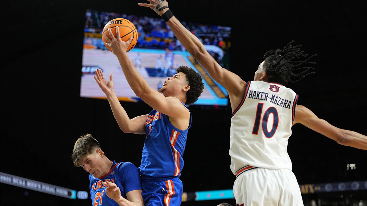 Florida Gators guard Walter Clayton Jr. (1) shoots the ball against Auburn Tigers guard Chad Baker-Mazara (10) during the second half in the semifinals of the men's Final Four of the 2025 NCAA Tournament at the Alamodome. Mandatory Credit: Bob Donnan-Imagn Images