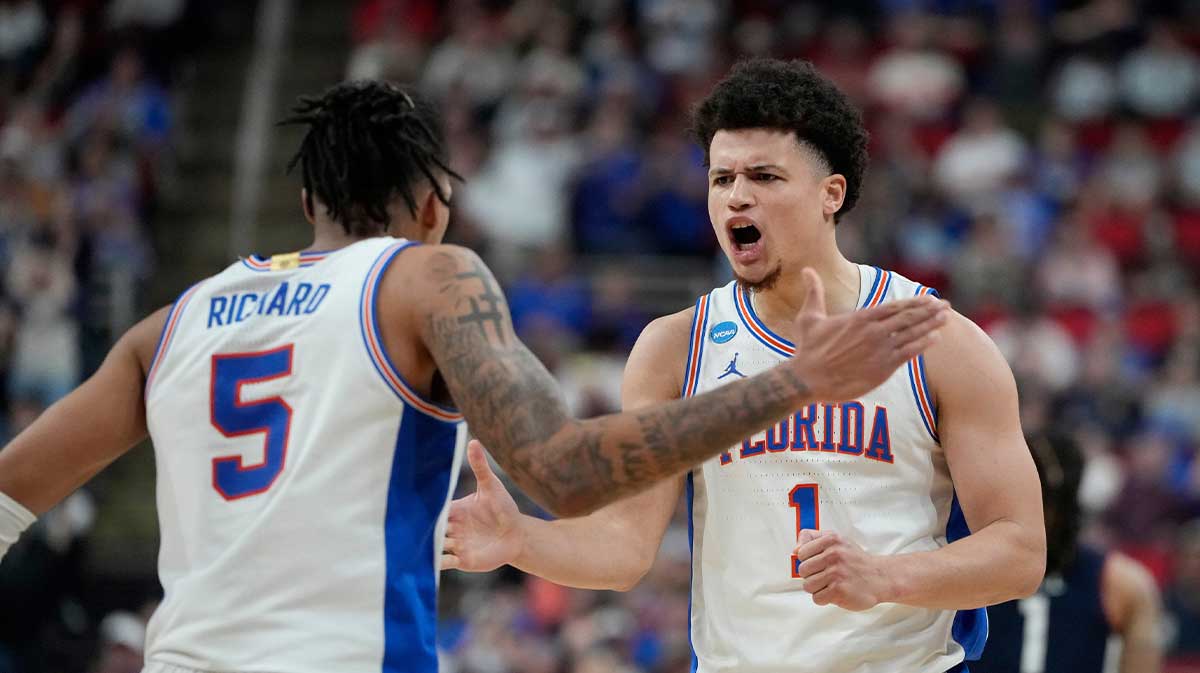 Florida Gators guard Walter Clayton Jr. (1) reacts with guard Will Richard (5) in the second half at Lenovo Center.
