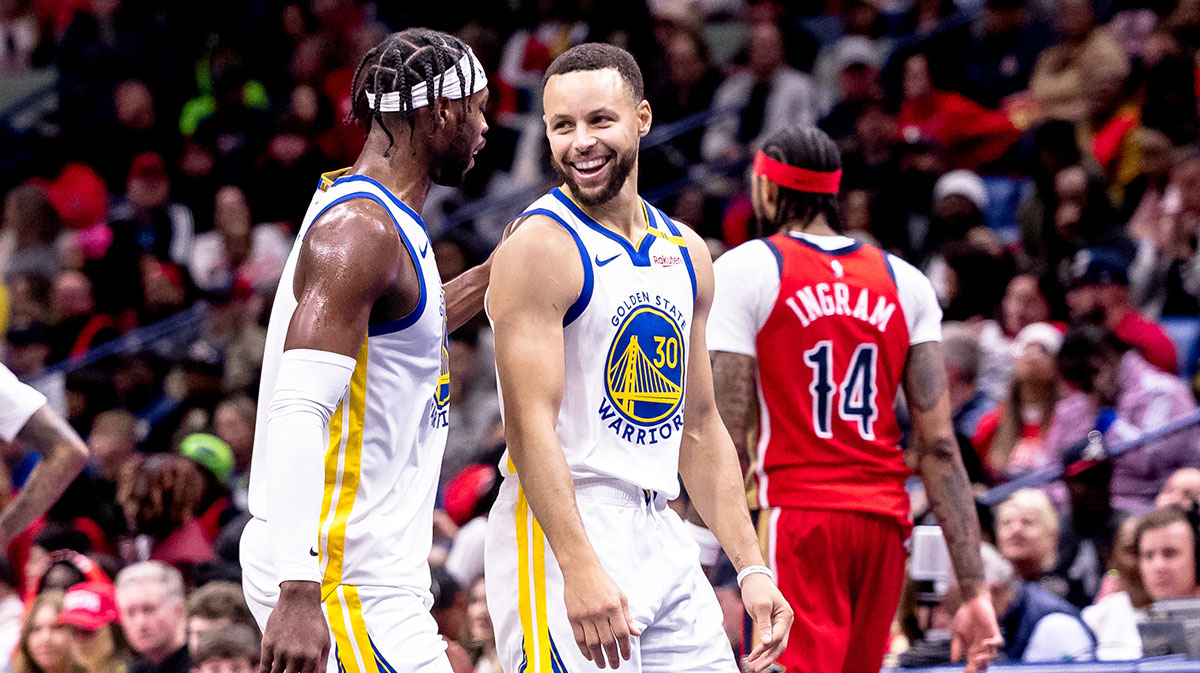 Golden State Warriors guard Stephen Curry (30) shares a moment with guard Buddy Hield (7) on a time out against the New Orleans Pelicans during second half at Smoothie King Center.