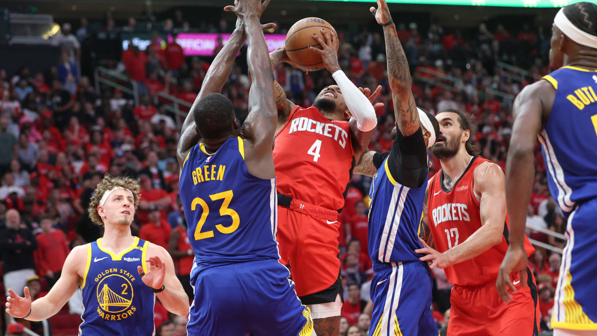 Golden State Warriors forward Draymond Green (23) defends against Houston Rockets guard Jalen Green (4) during the fourth quarter at Toyota Center.