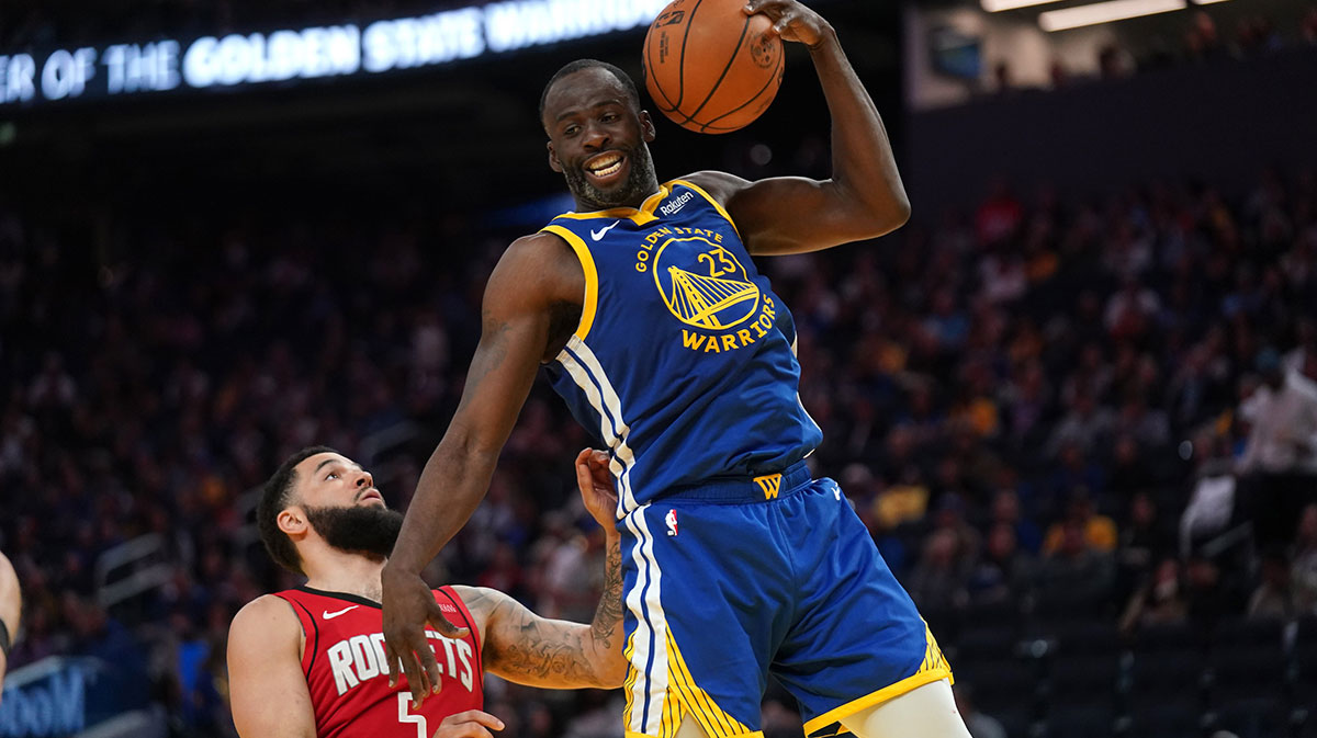 Golden State Warriors forward Draymond Green (23) holds onto a rebound in front of Houston Rockets guard Fred VanVleet (5) in the third quarter at the Chase Center.