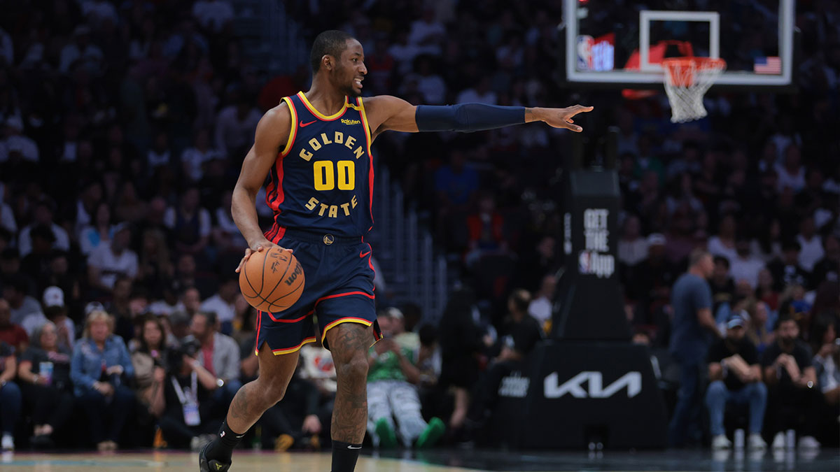 Golden State Warriors forward Jonathan Kuminga (00) signals against the Miami Heat during the first quarter at Kaseya Center.