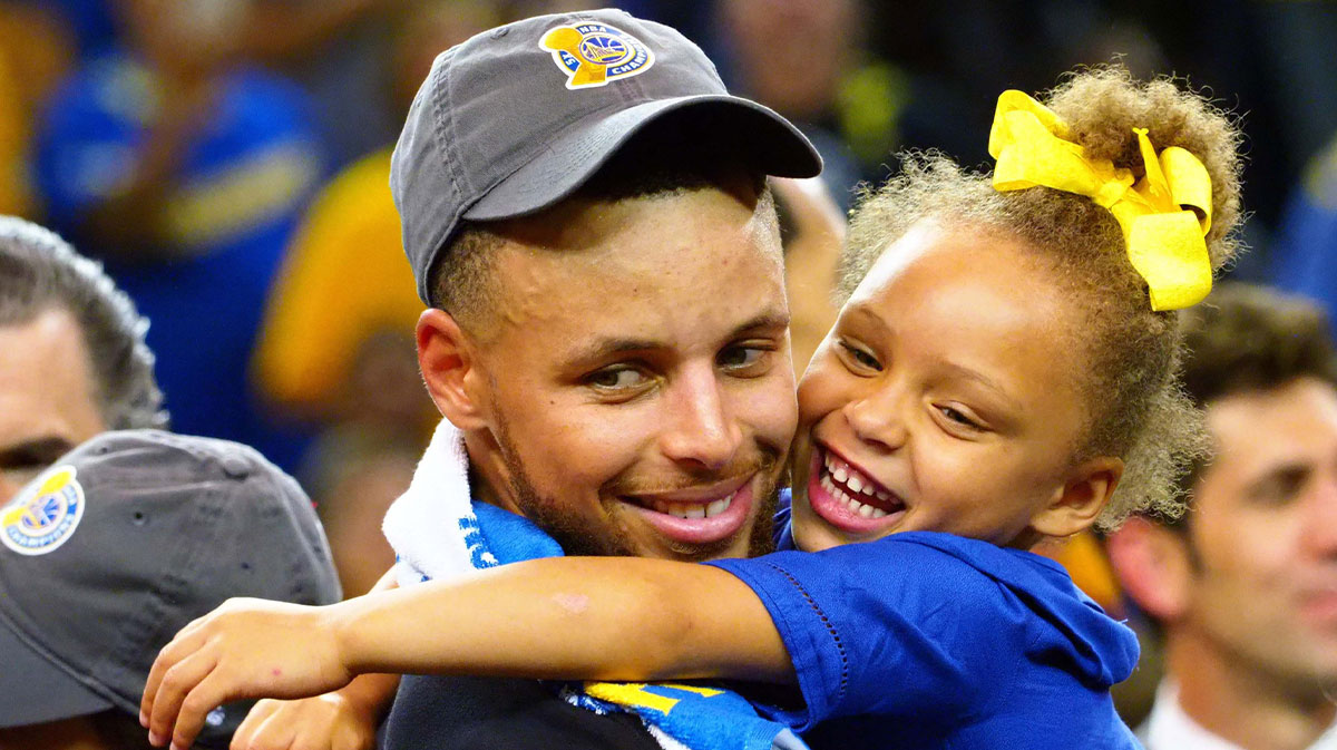 Golden State Warriors guard Stephen Curry (30) celebrates with his daughter Riley Curry after beating the Cleveland Cavaliers in game five of the 2017 NBA Finals at Oracle Arena.