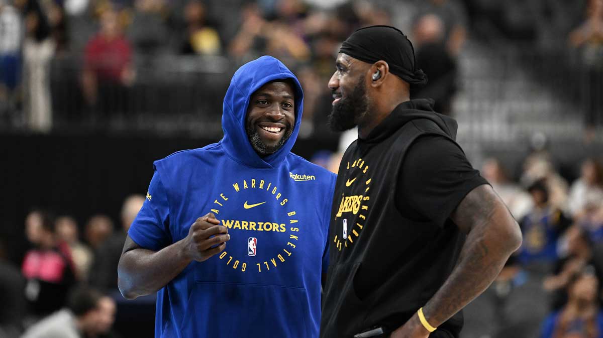 Warriors forward Draymond Green (23) and Los Angeles Lakers forward LeBron James (23) talk