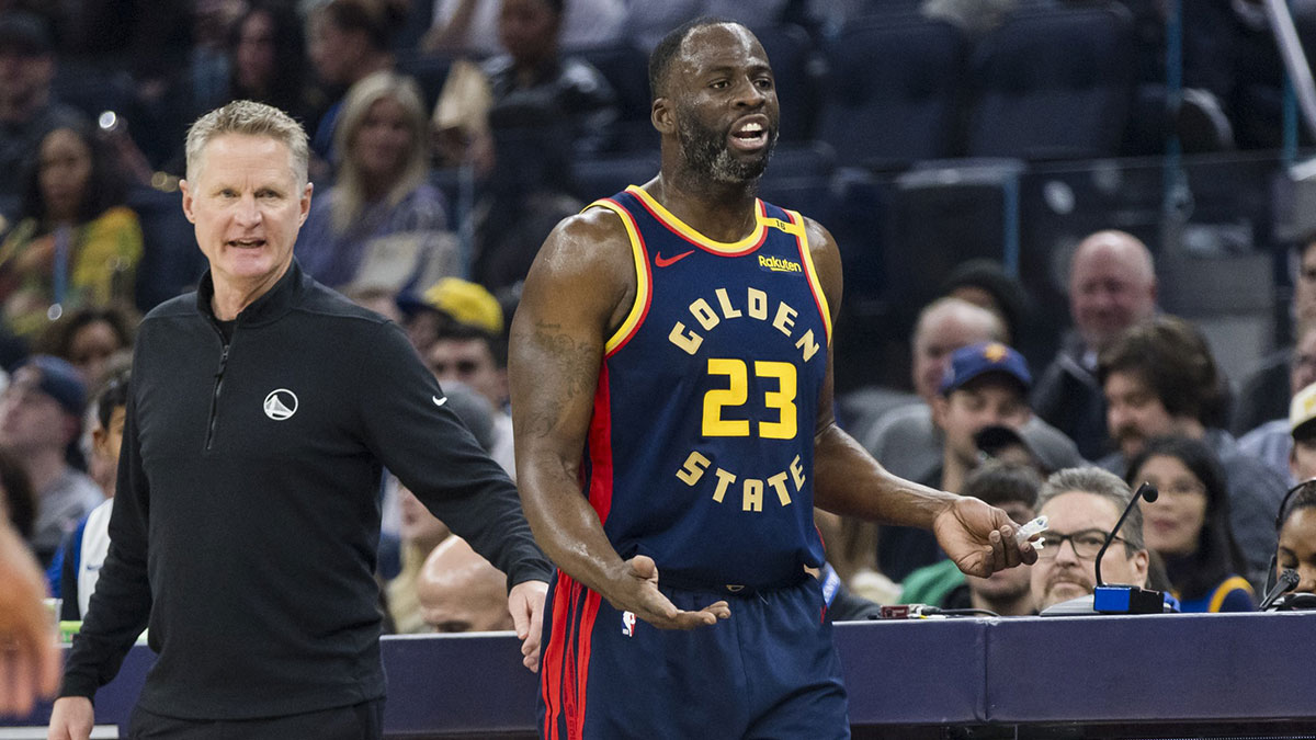 Golden State Warriors forward Draymond Green (23) and head coach Steve Kerr react during the first quarter against the Miami Heat at Chase Center.