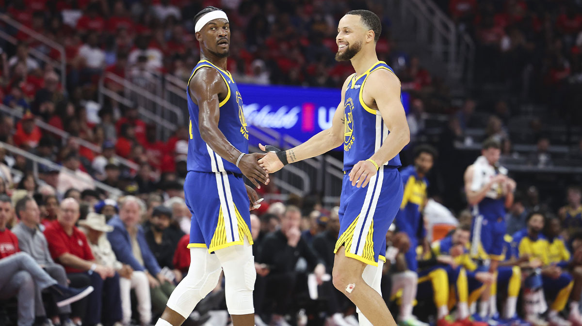 Warriors guard Stephen Curry (30) celebrates with forward Jimmy Butler