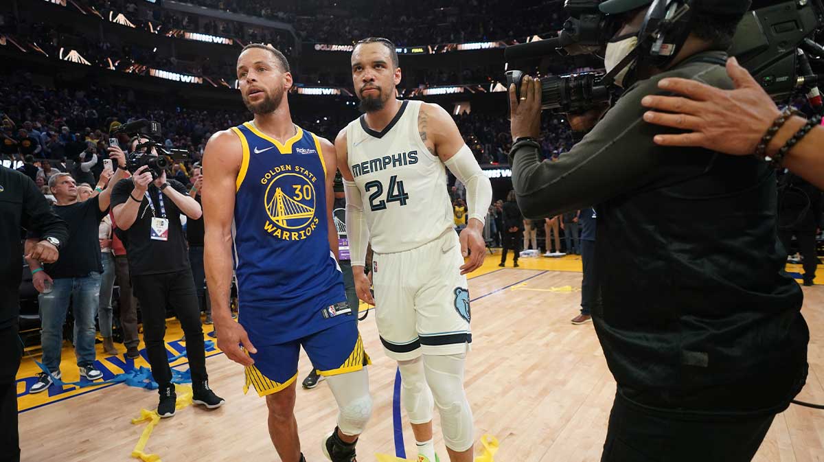 Warriors guard Stephen Curry (30) meets with Memphis Grizzlies guard Dillon Brooks (24) after game six