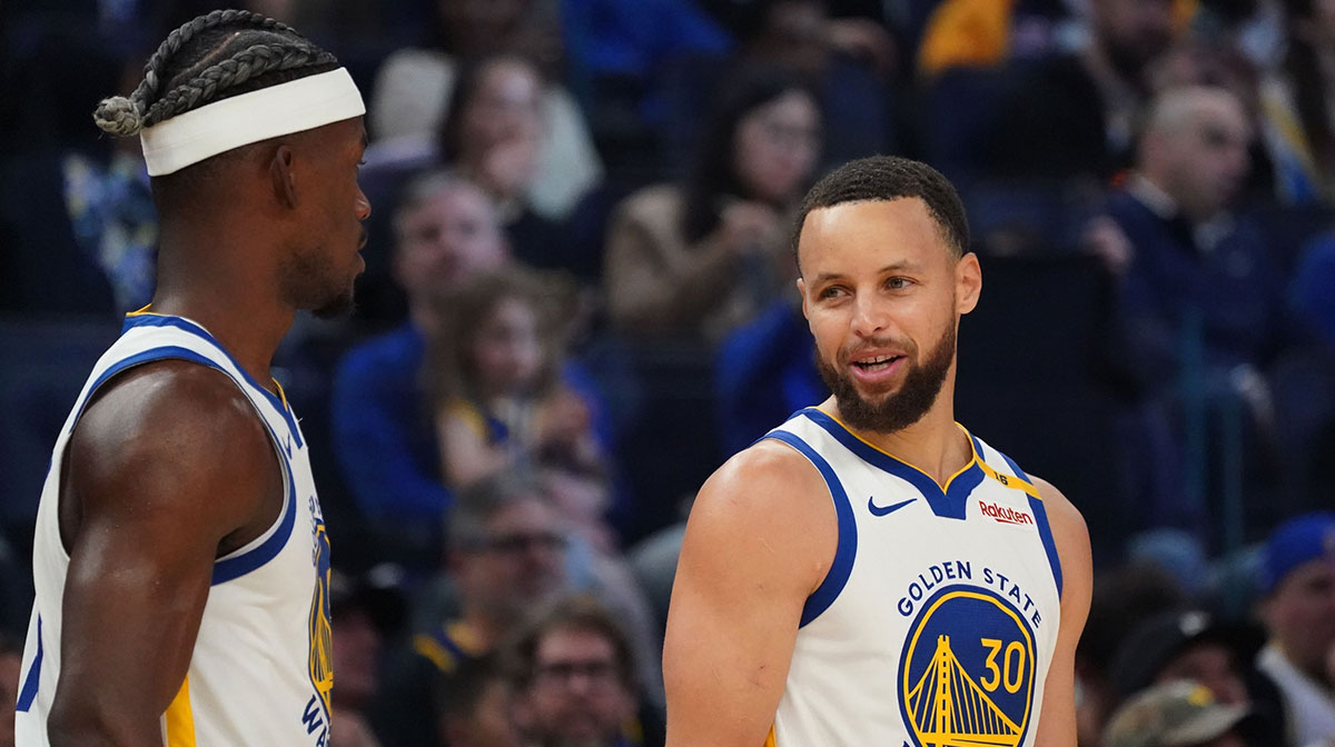 Golden State Warriors guard Stephen Curry (30) talks with forward Jimmy Butler III (10) vs. the Detroit Pistons in the first quarter at Chase Center. Warriors injury update