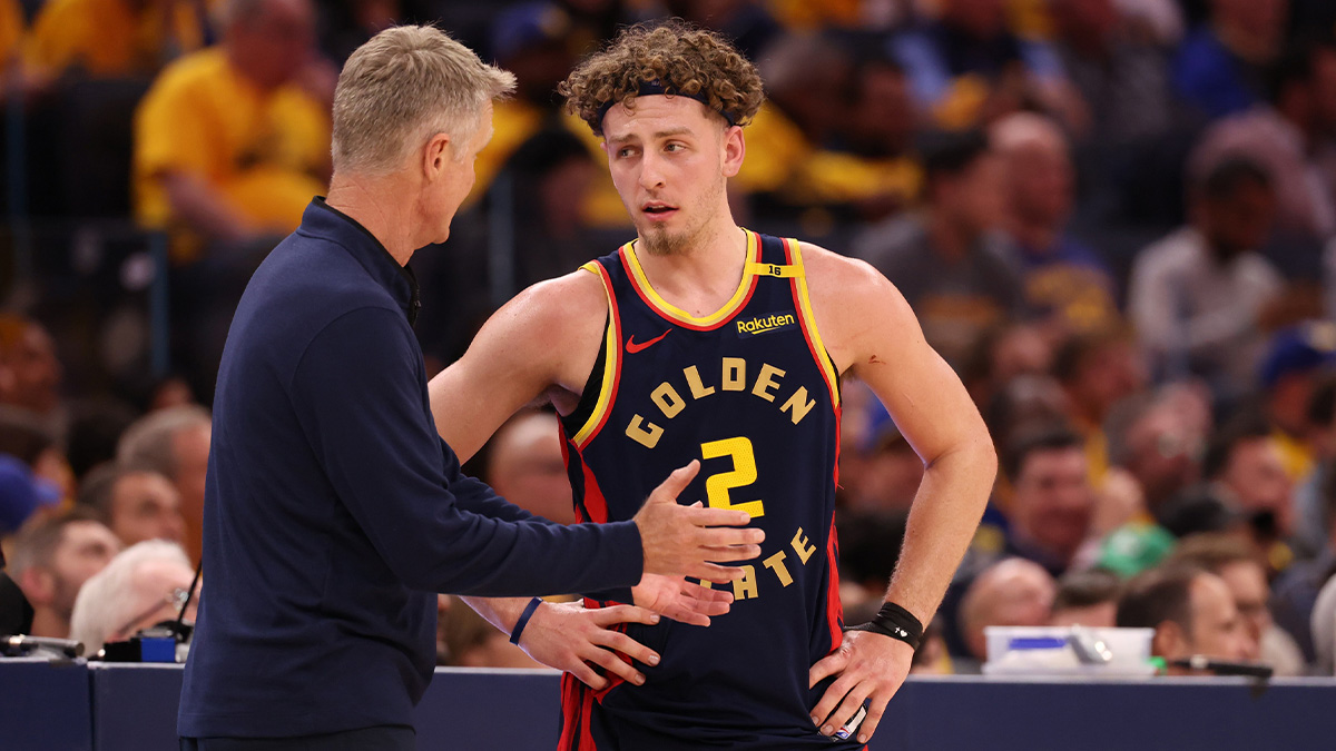 Golden State Warriors Golden State Warriors Steve Kerr speaks with guard Brandin Podziemski (2) during the third quarter of game four of the 2025 NBA Playoffs first round at Chase Center.