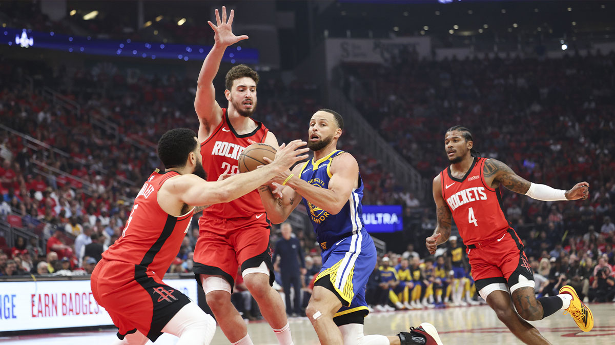 Houston Rockets guard Fred VanVleet (5) and center Alperen Sengun (28) defend against Golden State Warriors guard Stephen Curry (30) during the first quarter during game two of the first round for the 2024 NBA Playoffs at Toyota Center.