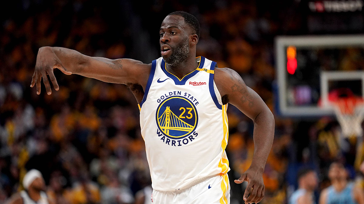 Warriors forward Draymond Green (23) reacts after being called for a foul against the Memphis Grizzlies in the fourth quarter at the Chase Center with the Rockets logo