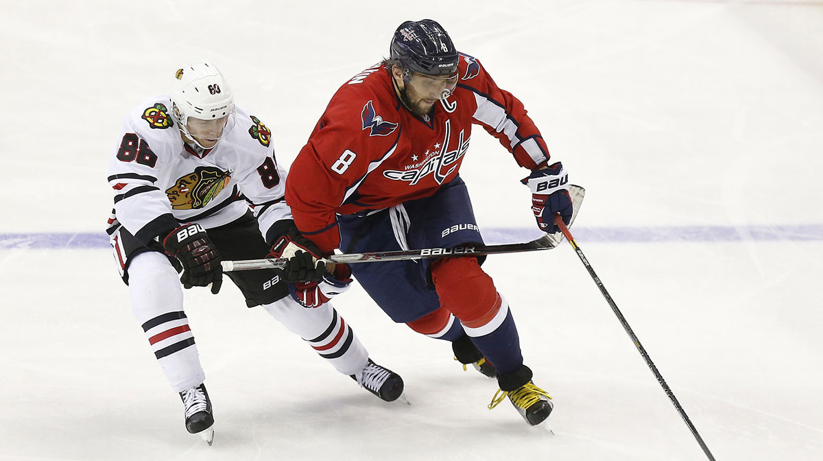 Washington Capitals left wing Alex Ovechkin (8) skates with the puck as Chicago Blackhawks right wing Patrick Kane (88) defends in the third period at Verizon Center.