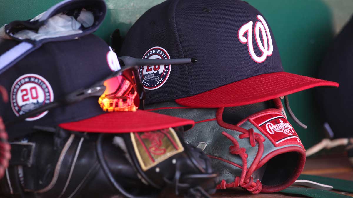 Washington Nationals hats and gloves in the dugout against the Pittsburgh Pirates during the sixth inning at PNC Park.