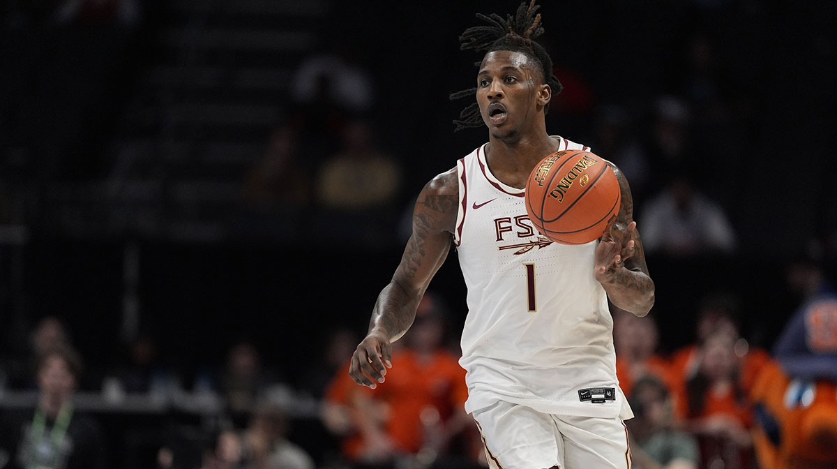 Florida State Seminoles guard Jamir Watkins (1) brings the ball up court against the Syracuse Orange during the second half at Spectrum Center.