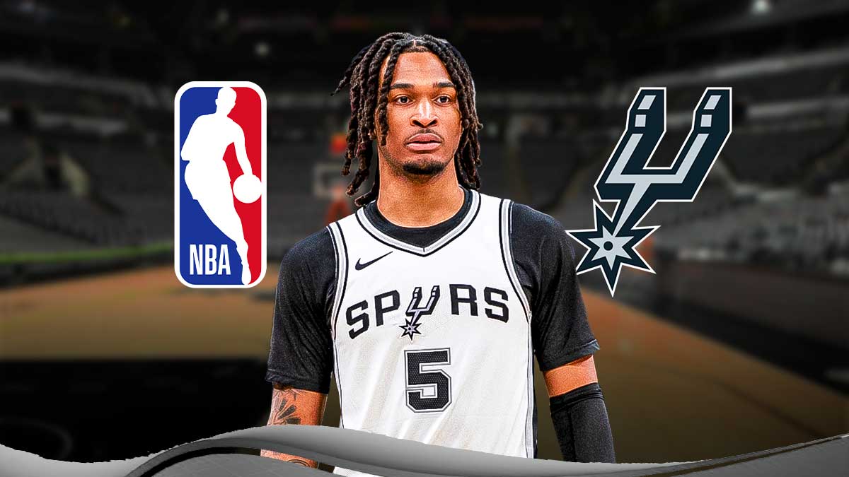 Stephon Castle image looking dissatisfied, Spurs logo, NBA logo in the background.