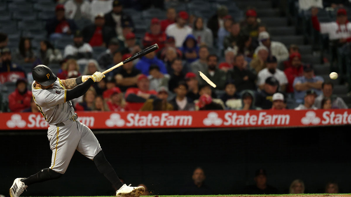 Pittsburgh Pirates left fielder Tommy Pham (28) hits an RBI single during the ninth inning against the Los Angeles Angels at Angel Stadium.
