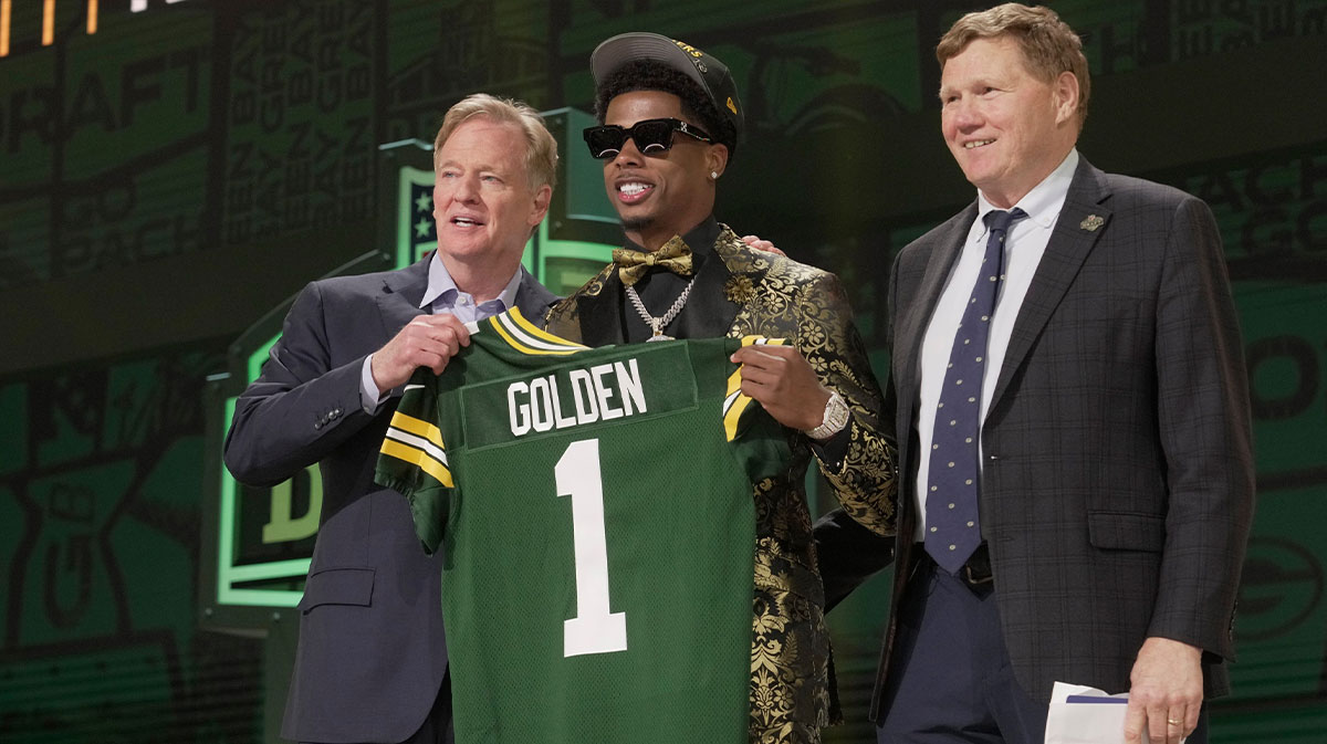 Wide Receiver Matthew Golden of Texas poses with NFL Commissioner Roger Goodell and President and CEO of the Green Bay Packers Mark Murphy