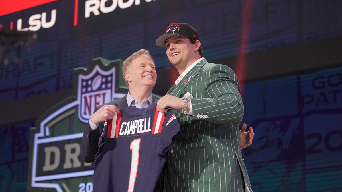 NFL commissioner Roger Goodell poses with Offensive Tackle Will Campbell of LSU after he is selected by the New England Patriots as the number four pick in the first round of the 2025 NFL Draft at Lambeau Field.