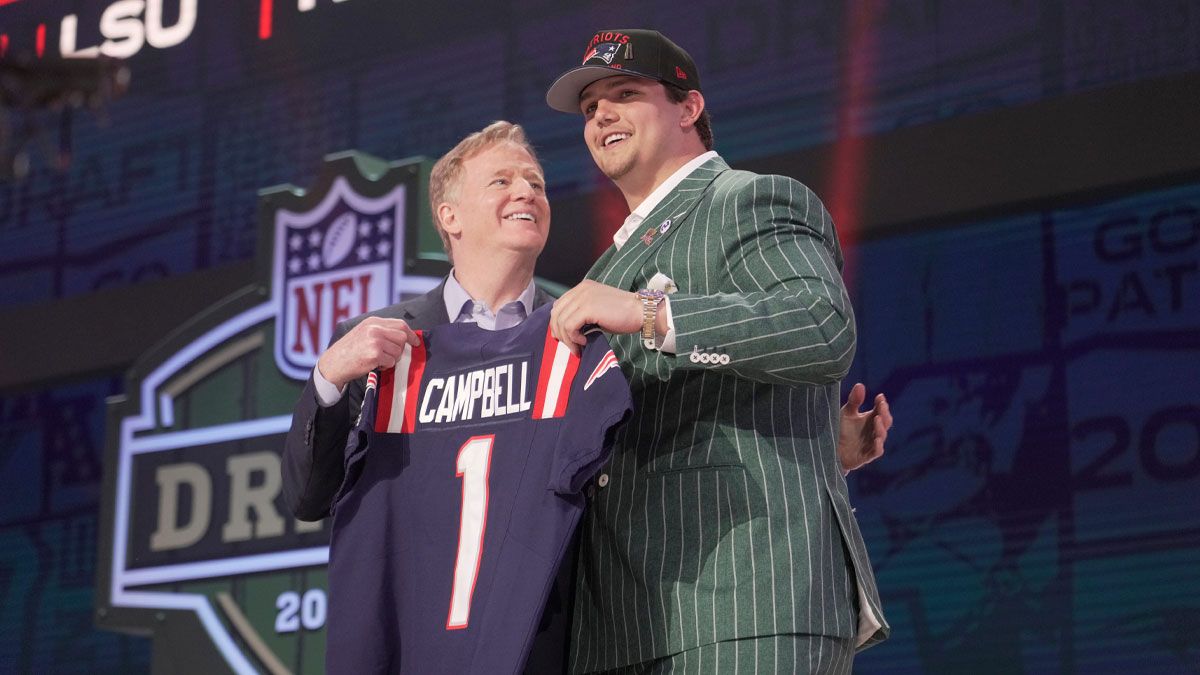 NFL commissioner Roger Goodell poses with Offensive Tackle Will Campbell of LSU after he is selected by the New England Patriots as the number four pick in the first round of the 2025 NFL Draft at Lambeau Field.