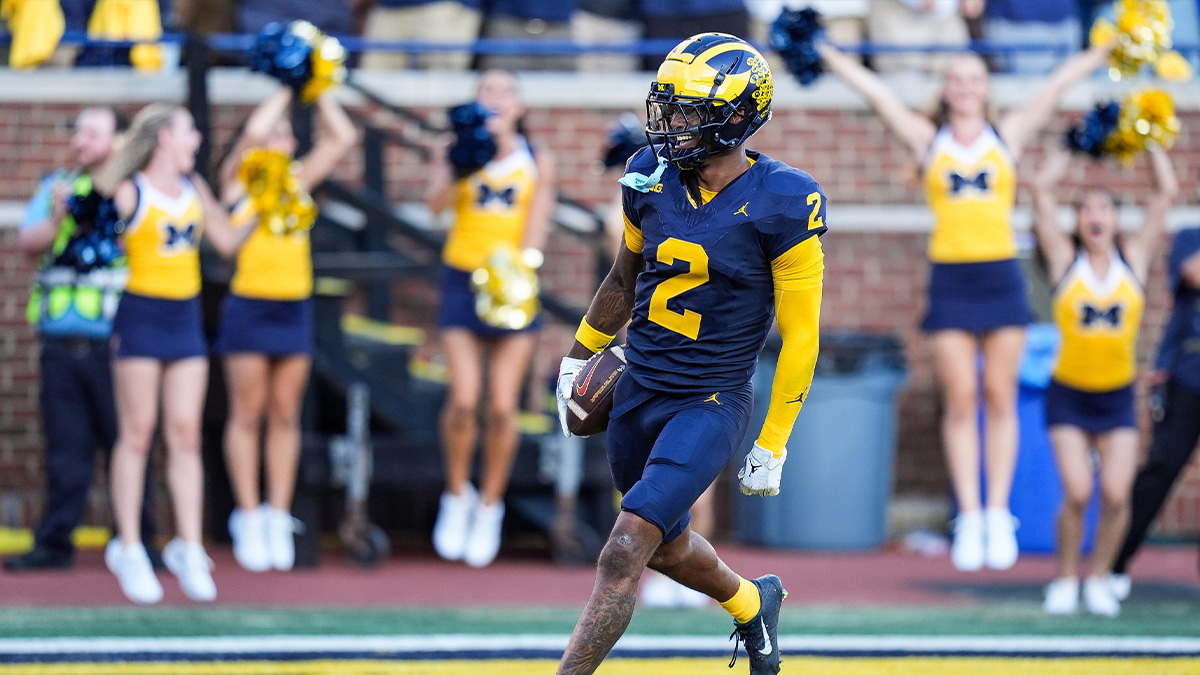 Michigan defensive back Will Johnson celebrates a touchdown after intercepting USC quarterback Miller Moss during the second half at Michigan Stadium in Ann Arbor on Saturday, Sept. 21, 2024.