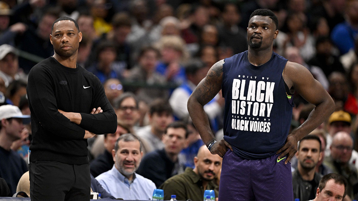 New Orleans Pelicans head coach Willie Green (left) and forward Zion Williamson (right) look on during the second half of the game against the Dallas Mavericks at the American Airlines Center.