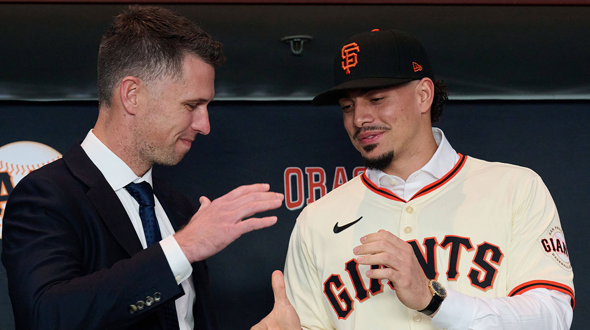 San Francisco Giants shortstop Willy Adames shakes hands with president of baseball operations Buster Posey during his introductory press conference at Oracle Park.
